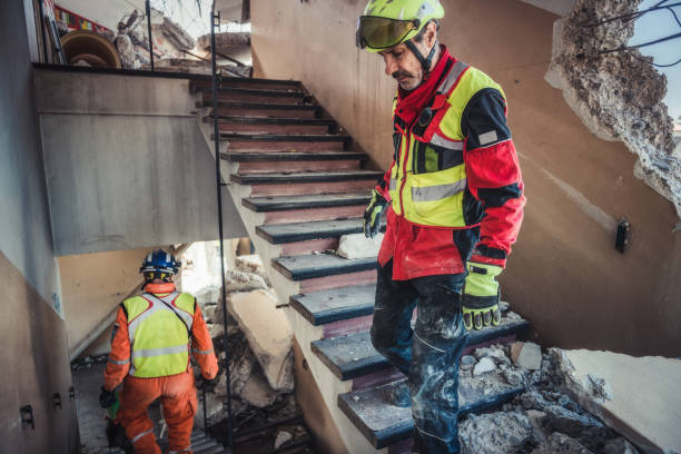 Rescuer search trough ruins of building